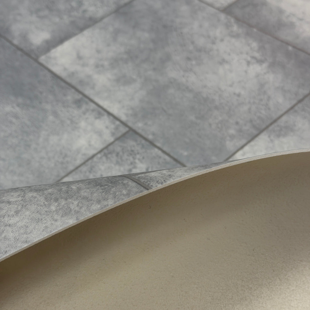 Kellars Luna grey tile effect vinyl flooring shown in Lara 098L